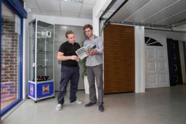 coventry garage doors team with customer in showroom